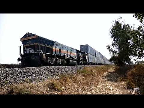 Diesel locomotive WDG4 showing their Power with Double Container freight train, clip 1