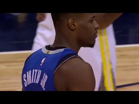 Dennis Smith Jr. try to dunk on Draymond Green