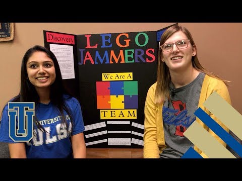 CIS students coach Girl Scouts Lego Robotics team