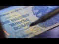 Authenticating Zimbabwe Currency (100 Trillion)