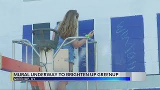 Mural underway to honor local river city's past, brighten future