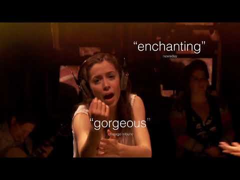 Once cast performing an ensemble number with strings and guitars