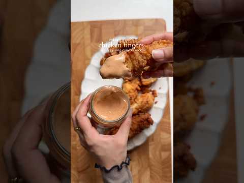 Raising cane’s chicken fingers with cane’s sauce.