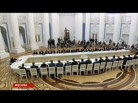 Putin talks tough one year into his presidency