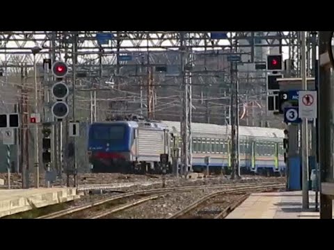 Italy: At Milano Forlanini station, a Trenitalia Class E464 electric loco passes on the main line