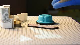 Stage 2 of making a stained glass piece. (grinding glass)