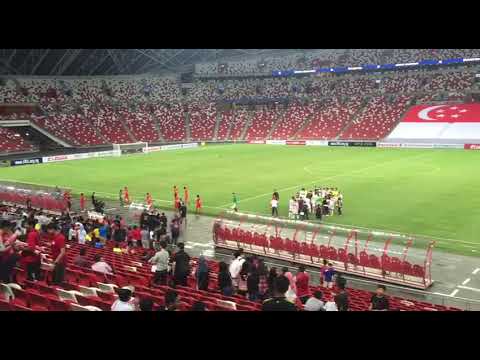 Players walking off the pitch after Singapore lost 3-0 to Bahrain