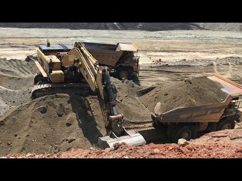 Caterpillar 385C Excavator Loading Caterpillar Dumpers
