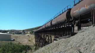 preview picture of video 'Union Pacific Oil Cans and Amtrak 14 at Stenner Creek Trestle HD'