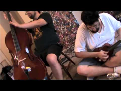 Travis Johnson and Kris Gruda at Apartment Music #9 - cello + guitar, ukulele - improvisation