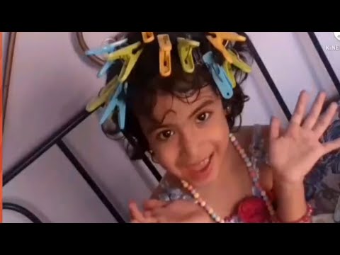 D Aroush playing with clothes peg and blocks.