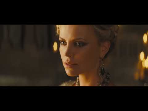 Trailer frame: end-credits glow over the hall as ‘Breath of Life’ swells