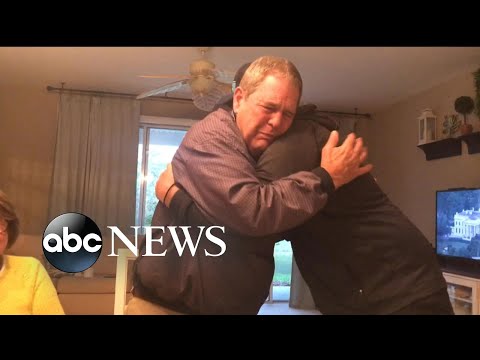 Son gifts father with photo album of some of their best times together