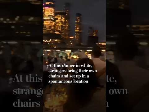 At this dinner in white, strangers bring their own chairs and set up in a spontaneous location