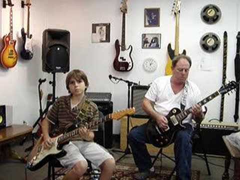 10 year old guitar slinger and Teacher play Blues