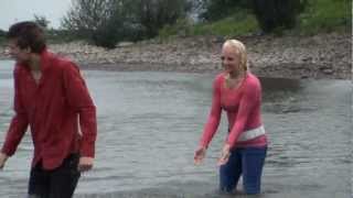 Kelly & Tom in jeans and pink shirt, white boots