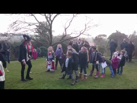 The Mad Hatter and Queen of hearts playing games on the Croquet lawn!