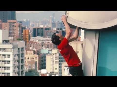 Alex Honnold free solo climbing the 11th tallest building in the world with no ropes