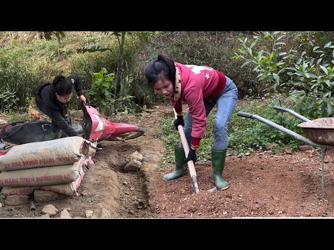 Hong prepares materials to build a pigsty alone