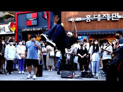 SUNDAY. ONLOOKER PRESENTING UNIQUE CAPTIVATING IMPROMPTU PERFORMANCE. DEEPLY TOUCHED. HONGDAE.