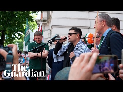 Crowds greet Kneecap rapper facing terrorism charge outside court