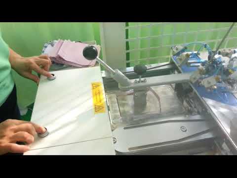 Automatic press for forming a shirt pocket with two loading sections video
