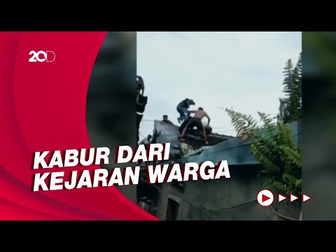 Dramatis! Pelaku Curanmor Dikeroyok Massa di Atas Atap