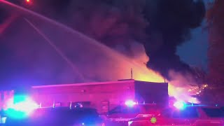 Firefighters battle massive flames at Hudson Ave. tire shop