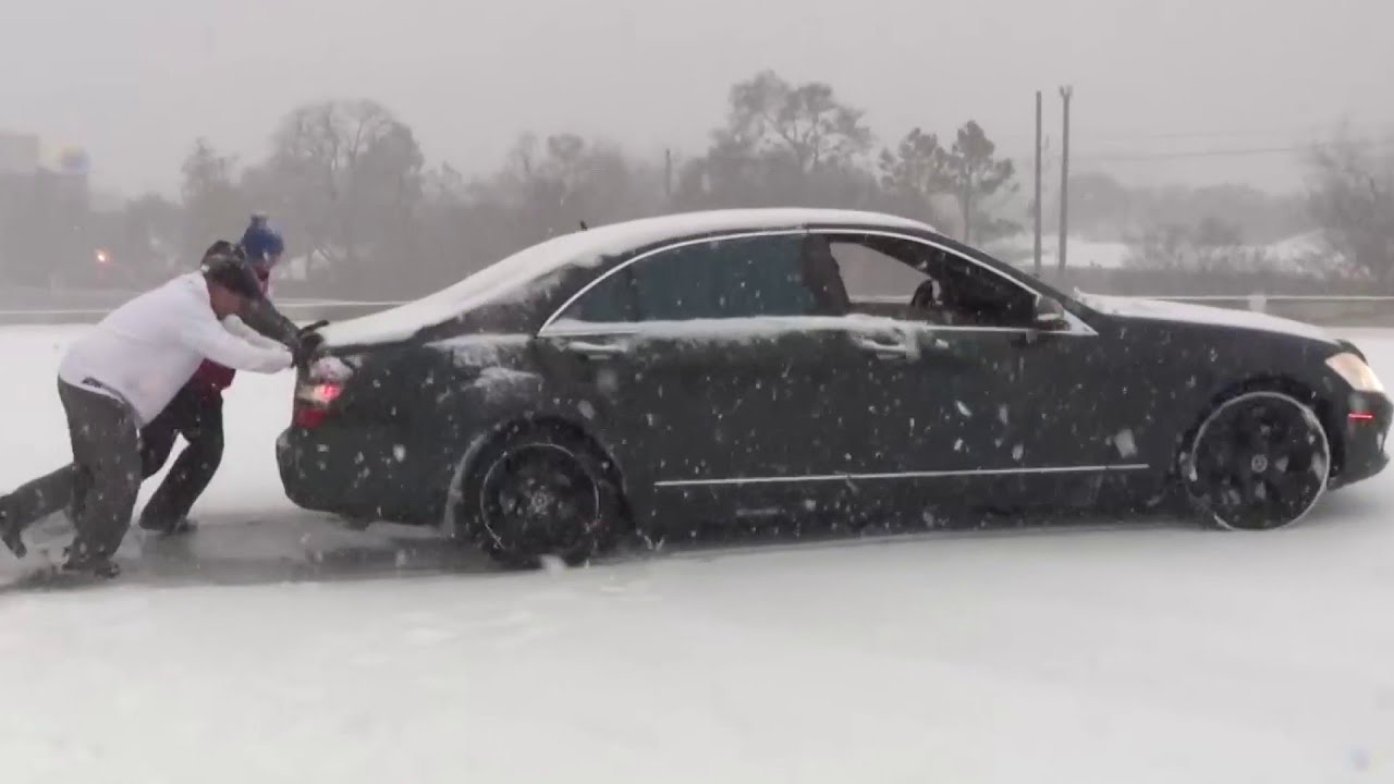 Houston driver stuck in snow spins out again on freeway