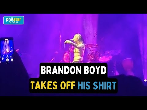 Incubus frontman Brandon Boyd takes off his shirt as he sings "Karma, Come Back" in Manila concert