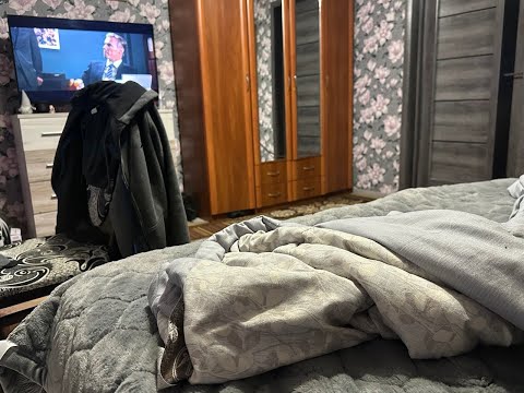 Healthy men and their girlfriends film the process of sawing a tree trunk.