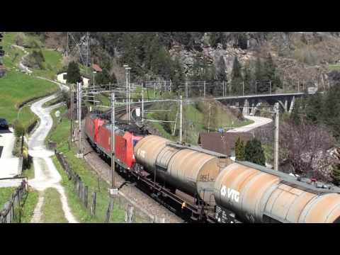 Switzerland:  DB light engines nbound passes a freight sbound at Wassen (Gotthard pass) 05/05/16