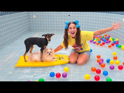 Mili the puppy's first swim in the pool, belonging to Mileninha.