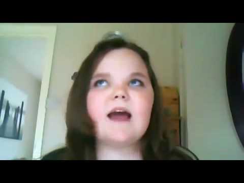 A girl is trying to sing I will always love you by Whitney Houston but keeps failing and gets angry