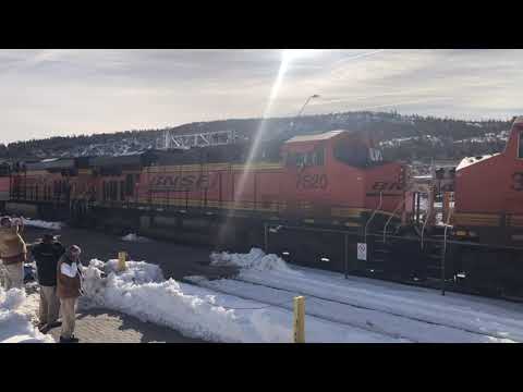 BNSF intermodal train racing through the snow in Williams, Arizona