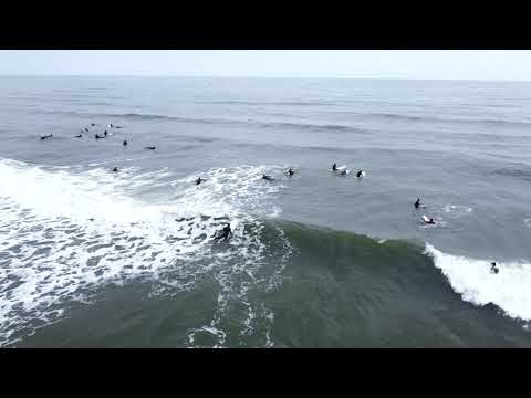 More aerial footage of surfers and fun swell at Whitley Bay