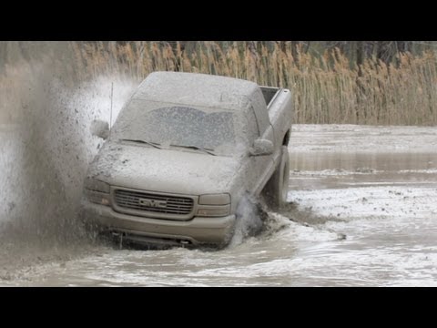 GMC Truck Battles In The Mud Pit