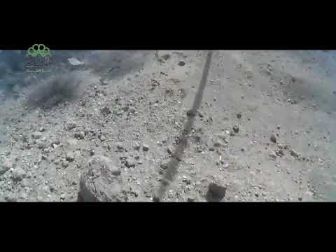 اشتباكات بين كتائب الجيش الحر وقوات النظام لحظة اقتحام مبنى إدارة المركبات العسكرية في مدينة حرستا في ريف دمشق