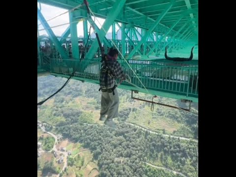 High-altitude thrill in China: bungee jumping from the Huajiang Bridge