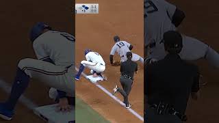 Fernando Cruz somehow gets the out at third base! ????