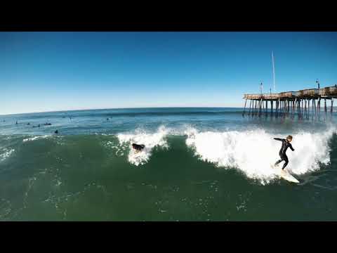 Drone footage of surfers at the Pier at Pismo 