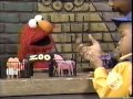 Sesame Street Elmo Plays With His Plastic Zoo Set