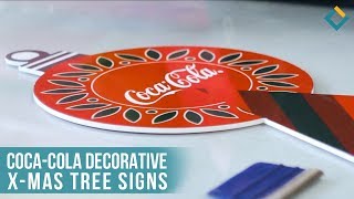 Coca-Cola decorative x-mas tree signs.