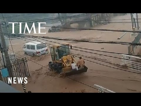 Family of Three Rescued in Beijing Flooding That Left At Least 20 Dead, Dozens Missing