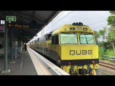 QL006, QL007, QL003 passing Waterfall with a empty steel train