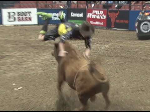 Bullfighter jumps over charging bull