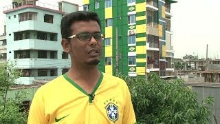 Pela Copa, torcedor pinta prédio inteiro de verde e amarelo em Bangladesh