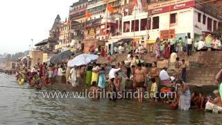 People take holy dip in the river Ganges, Varanasi