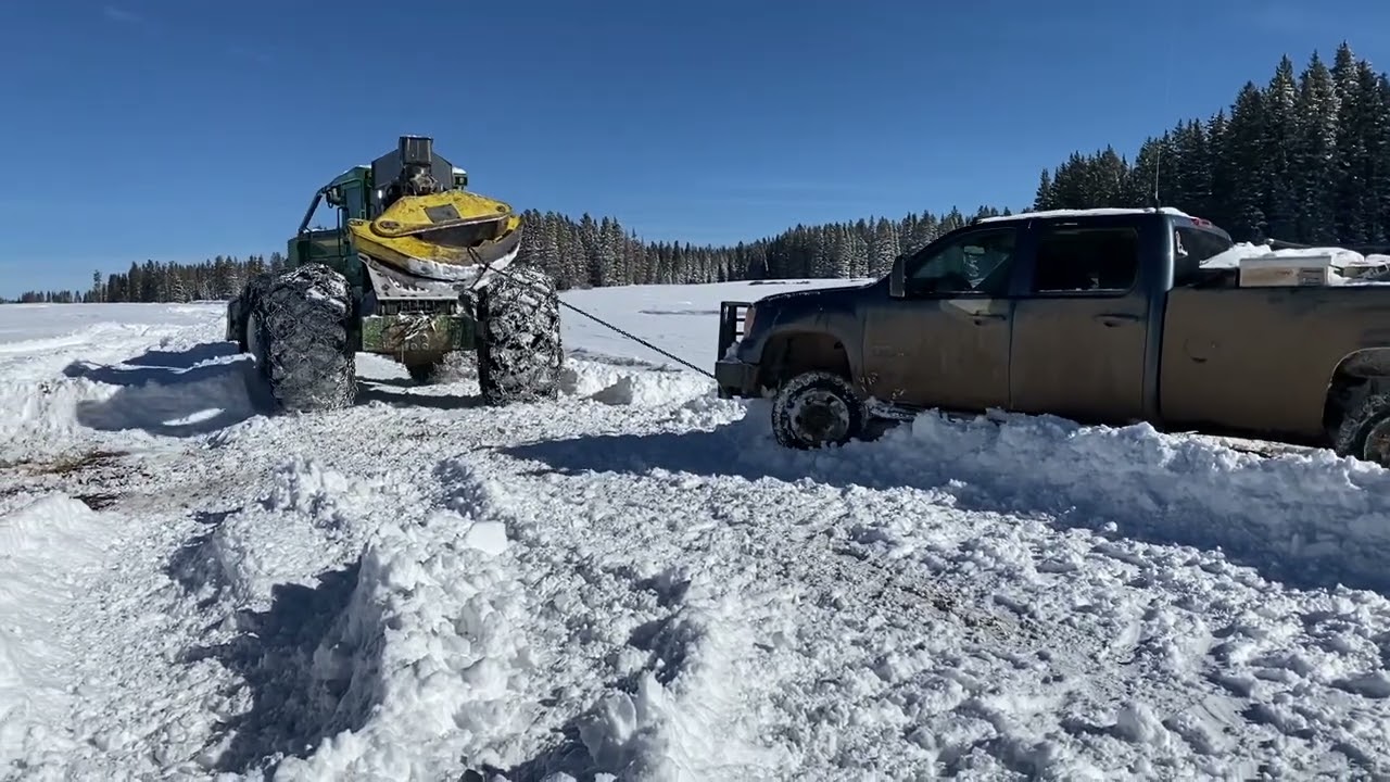 Recovering broken Duramax with skidder deep snow off-road