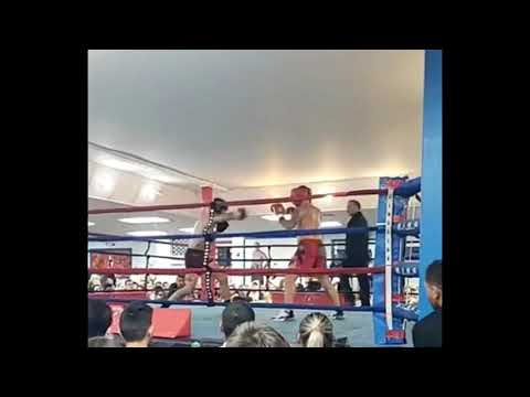 giving up 15 lbs in my first boxing match. fun!